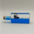 Creative liquid drift bottle cruise ship ornament with blue fluid and mini boat decor. - Square Bottle Pirate Ship