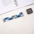 Close-up of elastic woven nylon watch strap with blue white pattern and cute cat metal buckle. - Blue & White