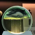 Circular luminous moving sand art picture desk lamp with green sand for home decor. - Black