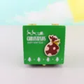 Wooden Christmas music box detail view, featuring a green festive design for holiday decor. - Money Bag (Clockwork)