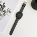 Detail view of the hybrid silicone leather watch strap with pin buckle, stylish and durable design. - 20mm / Dark Brown