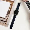 Detailed view of dark blue crocodile texture watch strap with pin buckle for smartwatch. - Midnight Blue