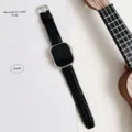 Black silicone leather watch strap with bamboo pattern and silver pin buckle detail. - Black