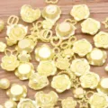 Mixed resin flower flatback cabochons detail shot, colorful DIY craft accessories parts. - 30g Pack / Yellow