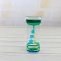Detailansicht des Flüssigkeits-Sanduhr-Timers, kreatives Öltropfen-Dekorationsspielzeug für den Tisch. - Cyan