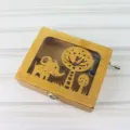 Wooden hand-cranked music box with cute elephant and tree cutout design, natural wood finish. - Elephant / 12 x 9.5 x 3.5 cm