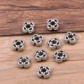 Perles intermédiaires creuses en alliage argent antique pour la création de bijoux. - Style Fleur Trèfle Creux (24H4-3)
