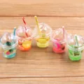 Close-up of miniature DIY resin fruit bear cups with colorful straws for handmade crafts. - Random Mixed