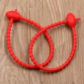 Reusable red silicone cable tie with oval head, flexible twist wire organizer and practical strap. - Red
