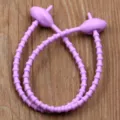 Reusable purple silicone cable tie with oval head, flexible binding strap for wire management. - Purple