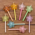 Detailed view of colorful resin cherry blossom lollipop pendants, DIY craft accessories charms. - Random Mixed Colors