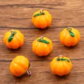 7pcs 17x17mm resin pumpkin charms pendants for diy jewelry making, necklace and bag accessories - Orange