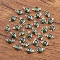 Connecteurs de bijoux œil maléfique fleur en acier inoxydable, charme de cristal vert. - Vert
