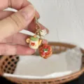 Detailed view of the handmade cute bear teapot and pastry flower charm keychain with gold clasp. - Strawberry Teapot Pendant