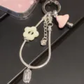 Exquisite silver snake chain keychain with cute pink mushroom and yellow flower charms for bags. - Pink Mushroom Silver Chain Charm