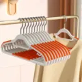 Non-slip clothes hangers seamless plastic coat hangers wet and dry use home wardrobe organization - 10 Pieces Pack / Double-Slot Style (Monsoon Orange)
