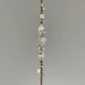 Handmade macrame crystal flower bracelet featuring woven cord and raw stone pendant design. - Cherry Blossom Braided Bracelet (1 Piece)