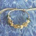 Handmade macrame crystal flower woven bracelet with raw stone and cute floral charms. - Gardenia Cord Bracelet