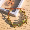 Handmade macrame woven crystal gemstone bracelet with green stone nuggets and brass bells. - Single Fluorite & Peridot Leaf Bell Bracelet