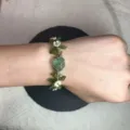 Handmade macrame crystal flower bracelet, green gemstone variant for stylish daily wear. - Midsummer Tale Cord Bracelet