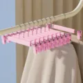 Conjunto de perchas rosas, pinzas de plástico para pantalones para almacenamiento en el hogar. - Pinza de Pantalón Mate / Rosa