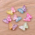 Pendentifs papillon en résine pailletée colorée avec anneaux métalliques pour bijoux DIY. - Papillon en Résine (26K01) / 10 Pièces/Pack / Dégradé pailleté