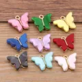 Breloques papillon en résine colorée avec contours dorés, parfaites pour la bijouterie DIY. - Papillon en Résine (22D3)