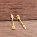 Detailed shot of miniature gold alloy arrow charm pendant, perfect for DIY jewelry making. - Gold