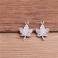 Detailed close-up of silver-tone maple leaf metal charms, perfect for DIY jewelry making. - Antique Silver