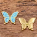 Vergoldeter Edelstahl Schmetterling Anhaenger mit blauem Oeltropfen Motiv 25x33mm - 1 Stück/Packung / Blau
