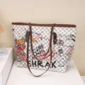 Large capacity women's tote bag, stylish graffiti shoulder bag for daily commute and fashion wear. - Graffiti White