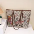 Large capacity graffiti tote bag, stylish shoulder bag with teddy bear print for women. - Graffiti Khaki