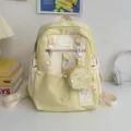 Zaino scolastico giallo e bianco carino con piccola custodia rotonda e ciondoli a stella. - Piccolo Senza Pendente / Giallo