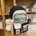 Süßer, farbblockierter Rucksack im College-Stil für Schüler mit Plüschanhängern und Vordertasche. - Mit Anhänger Und Zwei Lollis / Schwarz