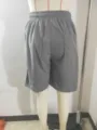 Men's corduroy drawstring shorts detail view, featuring back pocket and soft texture. - S / Bottoms / Gray