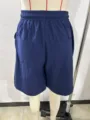 Detail shot of mens casual solid blue cotton linen shorts, showing back pockets and waistband. - 3XL / Dark Blue