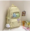 Süßer einfarbiger Schulrucksack mit transparenter Fronttasche und süßen Plüsch-Anhängern für Alltag. - Rucksack / Mit Abzeichen und Anhänger / Gelb
