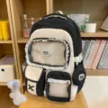 Süßer Schulrucksack in Kontrastfarben mit Spitzenbesatz, transparenter Vordertasche und Etui. - Mit Schleife Knochen Anhänger / Schwarz