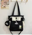 Schwarz-weiße Canvas Umhängetasche mit kleiner Tasche, stilvoller Shopper für den Alltag. - Schultasche Mit Anhänger / Schwarz