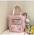 Rosa süße Ita-Bag mit transparentem Sichtfenster und bunten Ansteckern für Mädchen. - Studientasche / Mit Abzeichen und Anhänger / Rosa