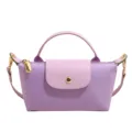 Lila Mini Nylon Handtasche und Schultertasche mit kurzem Henkel fuer den Alltag. - Taroviolett