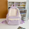 Lila und weißer Canvas Schulrucksack mit praktischer Fronttasche und schönem Design. - Kleine Größe (Ohne Anhänger) / Lila