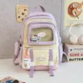 Süßer farbblockierter Kinder-Schulrucksack mit transparenter Fronttasche und Plüschbär-Anhänger. - Lila Groß (Mit Abzeichen und Anhänger)