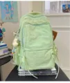 Lasser hellgruener Stoffrucksack fuer taegliches Pendeln, Reisen und Studenten mit vielen Faechern. - Grün mit Anhänger