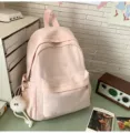 Süßer rosa Schulrucksack mit Schleifenstickerei und niedlichem flauschigem Plüschanhänger. - Rosa Klein mit Anhänger