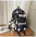 Schwarzer gesteppter Schulrucksack mit süßen Sternaufnähern und geräumigem Design. - Schwarz klein + 2 Schmetterlingssterne + Mondanhänger