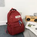 Sac à dos rouge simple de grande capacité pour étudiants, cartable décontracté quotidien. - Rouge avec Pendentif
