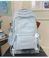 Leichter lässiger Freizeit Rucksack für Pendelverkehr einfarbige ästhetische Schultasche. - Blau mit weißem Bommel