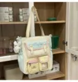 Niedliche Segeltuch-Tragetasche mit mehreren Taschen, mintgrüne und cremefarbene Variante, Tasche. - Shoulder Bag with Charm / Grün & Gelb