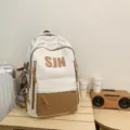 Trendy white and brown color block backpack with front zip pocket for daily school use. - Khaki Backpack with Pendant